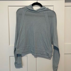 Cropped, hooded, long sleeve shirt. Very comfortable.